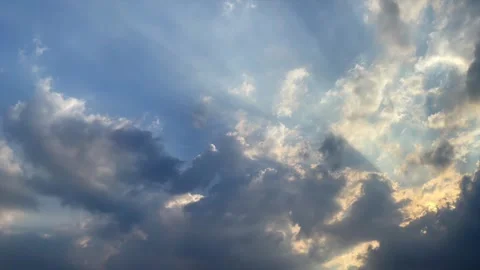 Dramatic cloudy sky with sun rays shining through moving sideways 스톡 동영상 341897795
