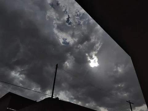 Dramatic Cloudy Sky with Sunlight Peeking Through Stock Photos