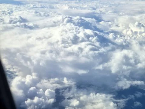 Dramatic cloudy sky with sunlit cloud formations Stock Photos