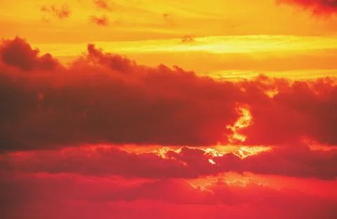 Dramatic cloudy sky at sunset. Orange red gradient color. Sky texture, abst.. Stock Photos
