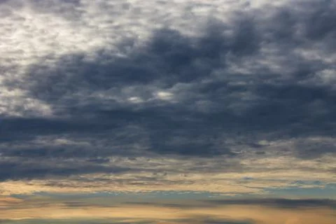Dramatic cloudy sky at sunset. Stock Photos