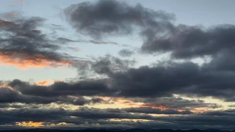 Dramatic cloudy sky at sunset Stock Photos