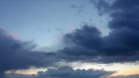 Dramatic cloudy sky at sunset. Timelapse footage of dark clouds on the sky. Stock Footage 151086391