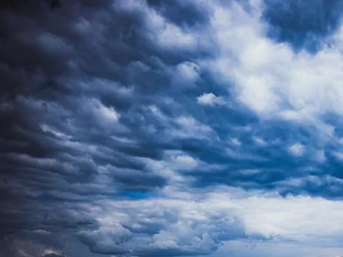 Dramatic cloudy sky texture with layered storm clouds Stock Photos