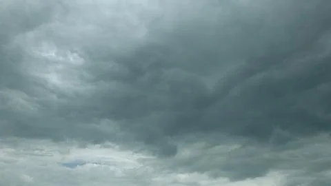 Dramatic Cloudy Sky There is a Dark Cloud Cover Overhead, creating an intense at Stock Photos
