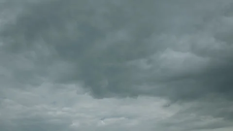 A Dramatic Cloudy Sky with Various Shades of Gray Enhancing the Overall Atmosphe Stock Footage 313470901