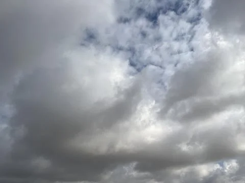 Dramatic cloudy sky with white and grey clouds Stock Photos