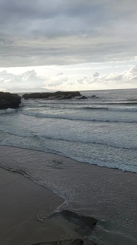 Dramatic cloudy sunset over Playa de Los Castros beach in Ribadeo Spain Video stock 337266201