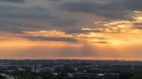 Dramatic cloudy sunset time lapse in city landscape Stock Footage 84164179