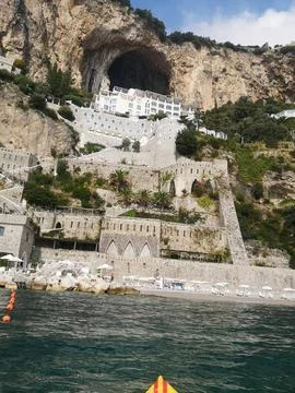 Dramatic Coastal Architecture Built into Cliffs Above the Sea in Southern Italy Stock Photos
