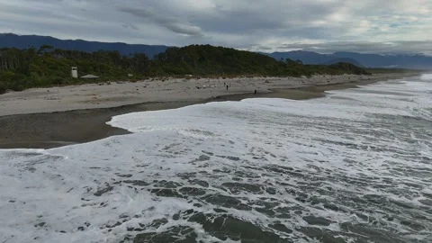 Dramatic coastal beach with mountains and stormy sky Stock Footage 341605843
