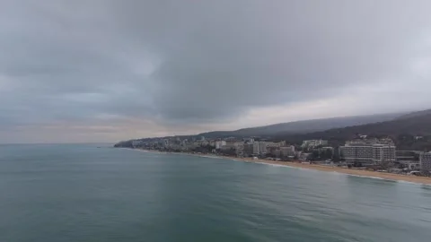 Dramatic Coastal City Skyline Under Dark Stormy Clouds Stock Footage 329285874