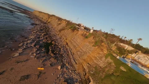 Dramatic coastal cliff with gentle waves Stock Footage 344562556