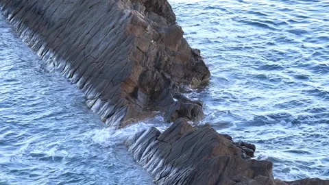 Dramatic Coastal Cliff with Waves Crashing Stock Footage 313661566