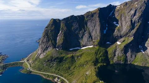 Dramatic Coastal Cliffs and Winding Road in Lofoten Norway Stock Photos