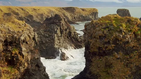 Dramatic Coastal Cliffs at Arnarstapi, Snaefellsnes Peninsula, Iceland Stock Footage 320202579