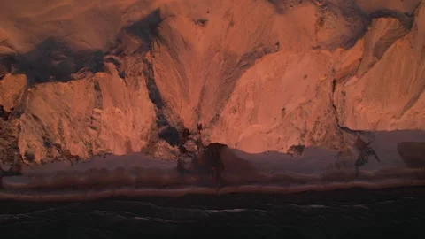 Dramatic Coastal Cliffs Glowing in Warm Sunset Light Stock Footage 343535515