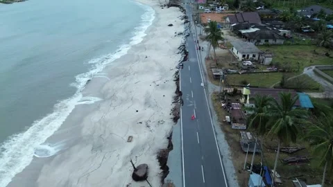 Dramatic Coastal Erosion Destroys Road - Powerful Footage of Nature's Impact Stock Footage 303945757