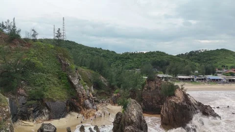 Dramatic coastal landscape with brown waves in Quang Binh. Stock Footage 313664519