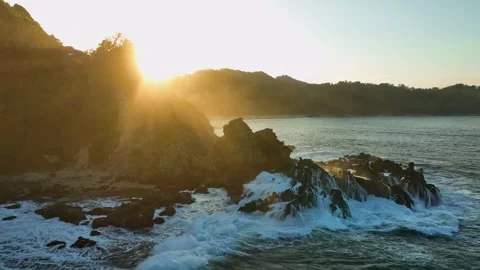 Dramatic Coastal Landscape with Ocean Waves at Sunset Stock Footage 338313491