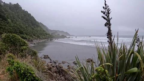 Dramatic Coastal landscape : Rugged Black Sand Beach at rainy stormy day on.. Stock Footage 289801035