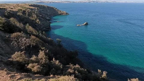 Dramatic Coastal Landscape with rugged cliffs, turquoise waters, and unique.. Stock Footage 312065778