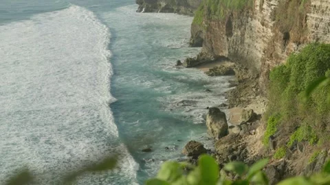 Dramatic Coastal Landscape Steep Cliffs, Waves, and Foam at the Edge of the.. Stock Footage 254932202