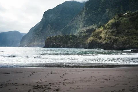 Dramatic Coastal Landscape with Steep Lush Cliffs, Turbulent Ocean Waves, a.. Stock Photos