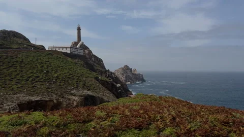 Dramatic coastal lighthouse on Galicia cliff over Atlantic Ocean Video stock 318309679