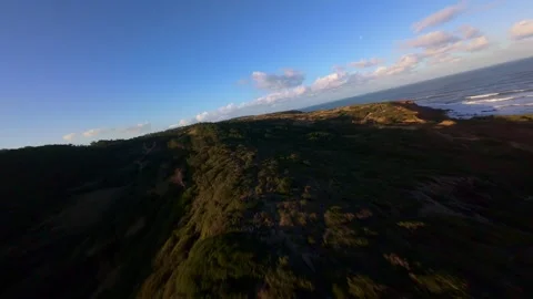Dramatic coastal scene with crashing surf and layered cliffs Stock Footage 344577716