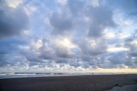 Dramatic Coastal Storm Clouds Above Black Sand Beach 스톡 사진