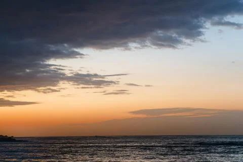 Dramatic Coastal Sunset With Golden Light Over Sea 写真素材
