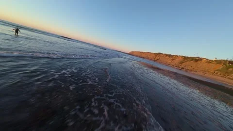 Dramatic coastal view with crashing waves and cliffside sunset Video stock 344561606