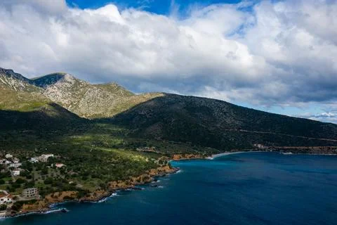 Dramatic coastline with mountains and blue sea Stock Photos