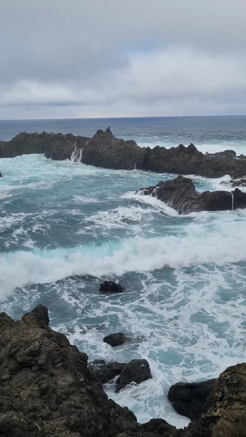 The dramatic coastline of Tenerife, Charco del Viento, features powerful waves  Stock Footage 307632226