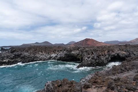 Dramatic coastline view Los Hervideros, volcanic turquoise waters in Lanzarote Stock Photos