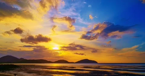 Dramatic colorful clouds background,Beautiful 4K Time lapse of Majestic sunset c Stock Footage 243401242