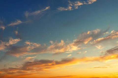 Dramatic colorful red orange to dark blue sunset or sunrise sky landscape clouds Stock Photos