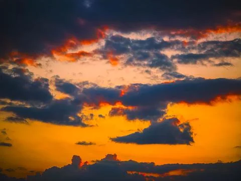 Dramatic Colorful Sunset with Fiery Clouds Stock Photos