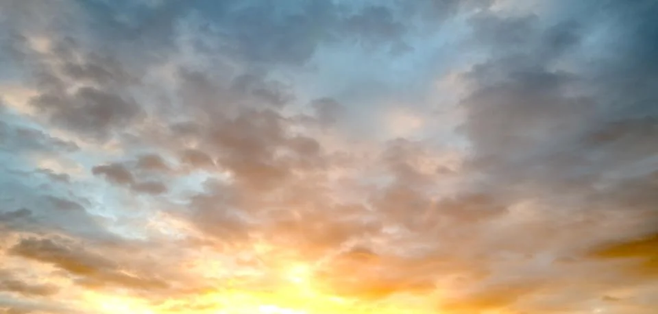 Dramatic Colorful Sunset Sky. Clouds with Sunrays. Cloudscape Sunset Background Stock Photos