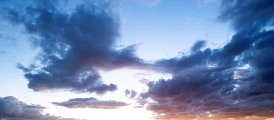 Dramatic Colorful Sunset Sky. Clouds with Sunrays. Cloudscape Sunset Background Stock Photos