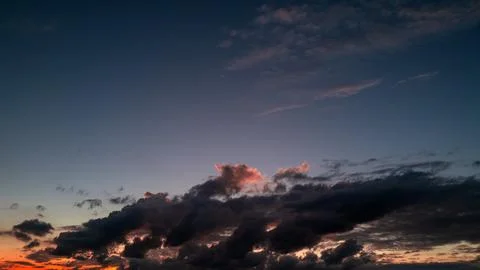 Dramatic Colorful Sunset Sky. Clouds with Sunrays. Cloudscape Sunset Background Stock Photos
