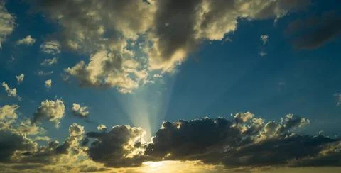 Dramatic Colorful Sunset Sky. Clouds with Sunrays. Cloudscape Nature Background Stock Photos