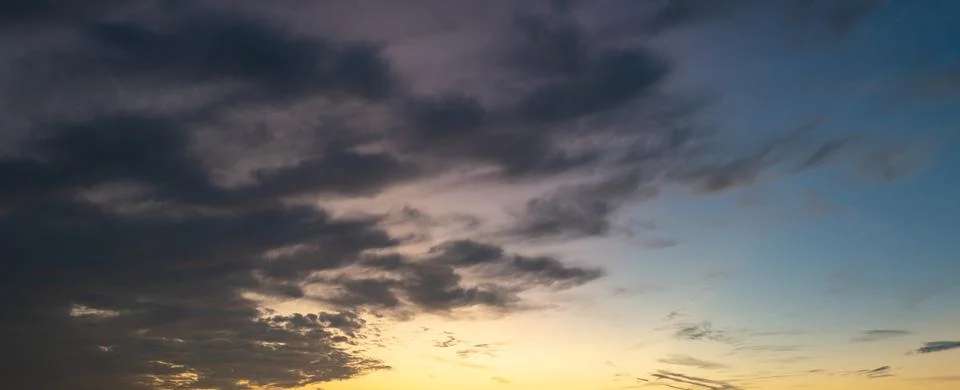 Dramatic Colorful Sunset Sky. Clouds with Sunrays. Cloudscape Sunset Background Stock Photos