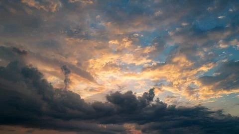 Dramatic Colorful Sunset Sky. Clouds with Sunrays. Cloudscape Nature Background Stock Photos