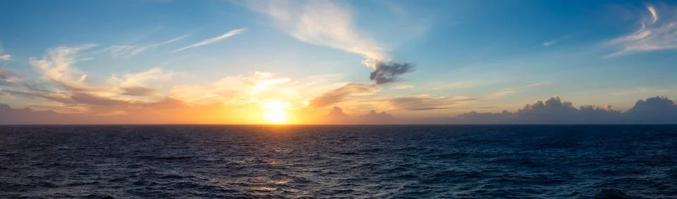 Dramatic Colorful Sunset Sky over North Atlantic Ocean. Cloudscape Nature Stock Photos
