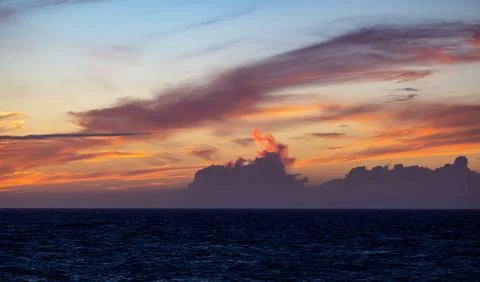 Dramatic Colorful Sunset Sky over North Atlantic Ocean. Cloudscape Nature Stock Photos