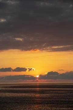 Dramatic Colorful Sunset Sky over Black Sea. Cloudscape Nature Background Stock Photos
