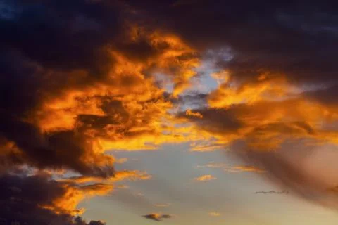 Dramatic colourful storm clouds glowing at sunset, Calgary, Alberta, Canada Stock Photos