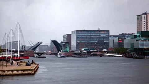 Dramatic Copenhagen Skyline with Bridge Opening for Vessel in Rain Stock Footage 312985297
